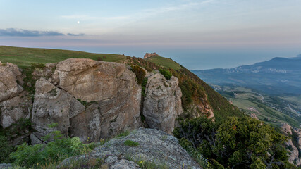 Fototapeta premium Walking in the mountains.Mount Demerdzhi in the Crimea. Sunset on the mountain. Fog in the mountains.