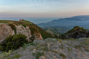Fototapeta na wymiar Walking in the mountains.Mount Demerdzhi in the Crimea. Sunset on the mountain. Fog in the mountains.