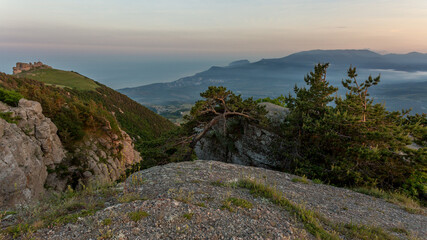 Walking in the mountains.Mount Demerdzhi in the Crimea. Sunset on the mountain. Fog in the mountains.