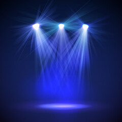 Spotlight on stage with smoke and light.