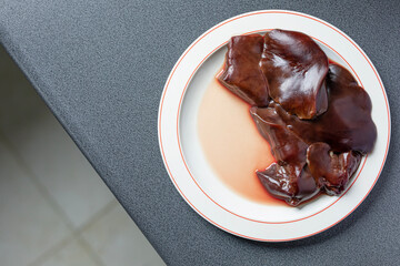 raw chicken livers on a plate, poultry livers 