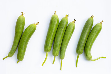 Fresh green sponge gourd or luff on white