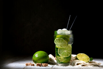Fresh made Mojito cocktail on dark background. Summer drinks concept.