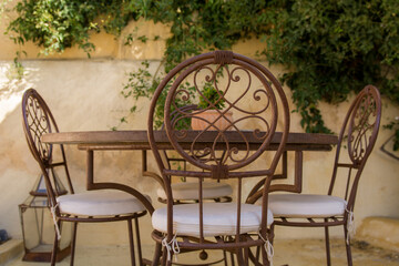 Outdoor patio vintage seating set of metal table and chairs. 
