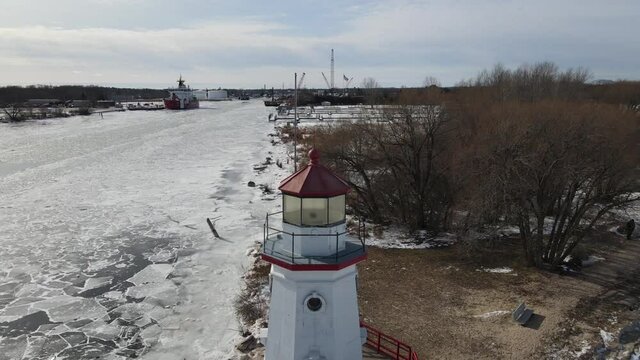 4k drone video of Cheboygan, Michigan lighthouse in winter.