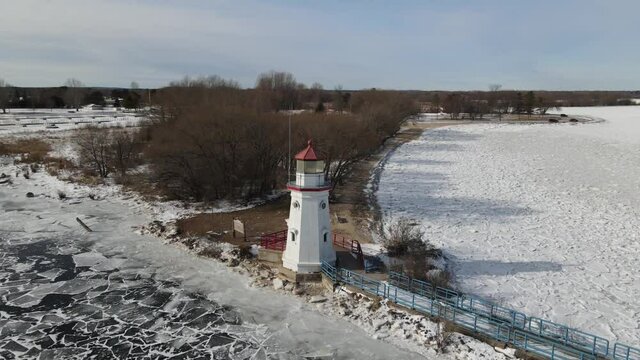 4k drone video of Cheboygan, Michigan lighthouse in winter.