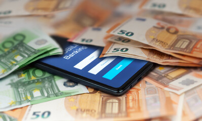 smartphone with stock exchange market application, euro banknotes