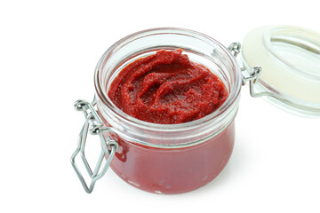 Glass jar of tomato paste isolated on white background