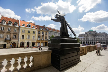 Fototapeta na wymiar Jesus Christ statue in front of the Holy Cross Church in Warsaw, Poland. June 2012