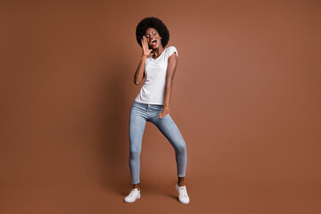 Fototapeta na wymiar Full length body size photo of girl dancing at party singing loud at karaoke in casual outfit isolated on brown color background