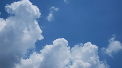 Natural daylight and white clouds floating on blue sky.
