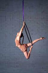 A Young Acrobat Woman Working on a Hoop