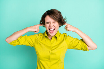 Photo portrait of annoyed irritated girl closed ears fingers shouting isolated on vibrant turquoise...