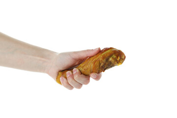 Female hand hold roast chicken drumstick, isolated on white background