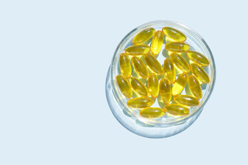 Omega3 gel capsule. Sun shadow. Yellow vitamin. Health eating. Dietology drug. Fish oil supplement....