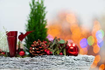 A close-up view of a Christmas reed during the ongoing Christmas season and the flickering bokeh of...