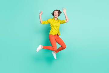 Fototapeta na wymiar Full length body size photo of jumping high woman waving hands greeting cheerful isolated bright turquoise color background