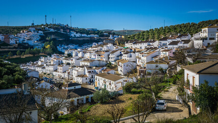 Obraz premium View on the white houses of the small village of Setenil de las Bodegas, one of the most famous white villages (Pueblo Blanco) of Andalusia, Spain