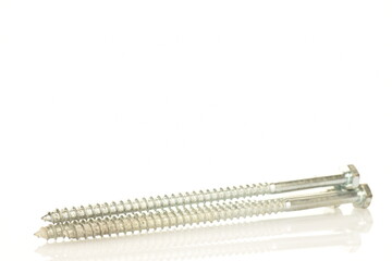 Three metal screws, close-up, isolated on white.