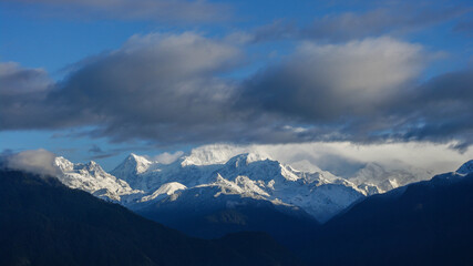 Beautiful sunrise panorama on snow-capped Kangchenjunga mountain in Himalaya range seen from Pelling, Sikkim, India
