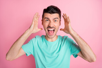 Portrait of young angry stressed unhappy annoyed depressed man scream shout conflict isolated on pink color background