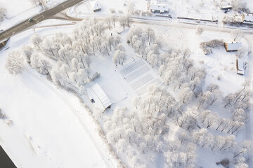 Obraz na płótnie Canvas Frost on the trees on a snowy winter day. Skrunda, Latvia. Captured from above.