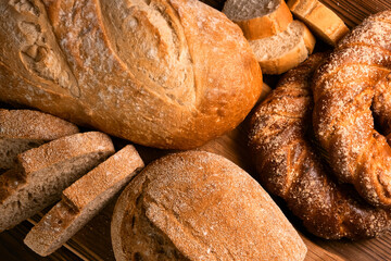 Different kinds of fresh bread as background