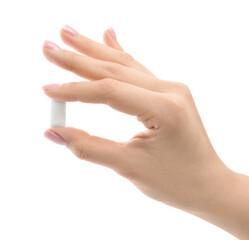 Woman holding chewing gum piece on white background, closeup