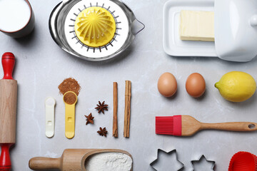 Fototapeta na wymiar Cooking utensils and ingredients on light marble table, flat lay