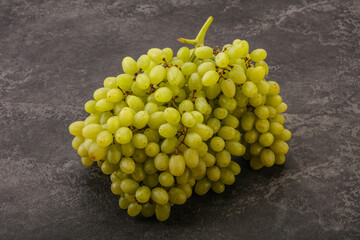 Green grape branch over background