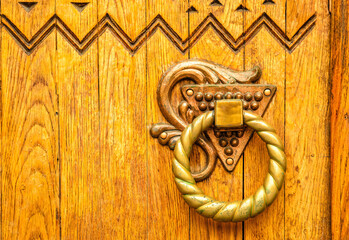 Poltava, Ukraine - April 14, 2021: beautiful wooden door with a carved floral pattern in the Ukrainianhistorical building in the Ukrainian Art Nouveau style. Museum of Local Lore in Poltava, Ukraine