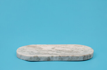 Empty gray marble geometric figure on blue background. Mockup template for display of your design, space for product display. for cosmetic product 