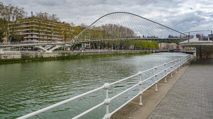 Bilbao, Spain - April 2, 2021: Zubizuri foot bridge across the River Nervion