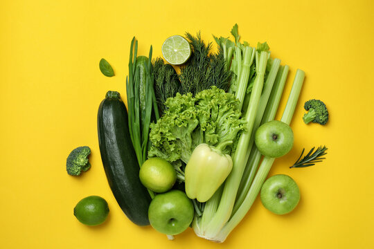 Group of green vegetables on yellow background