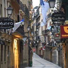 Fototapeta premium San Sebastian, Spain - Jan 10, 2021: the narrow streets and Pintxo bars of Parte Vieja in the early morning