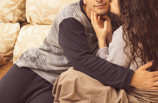 a wedding couple arguing on the sofa at home