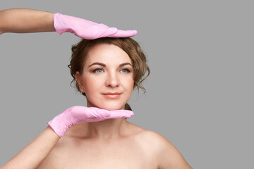 Doctor hands in protective medical gloves. Derma test. Prepare operation consultation. Pretty young...