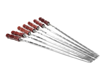 Metal skewers with wooden handle on white background