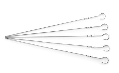 Metal skewers on white background, top view. Barbecue utensil