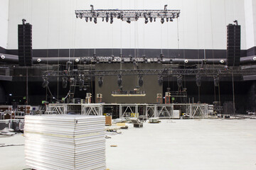 Installation of professional sound, light, video and stage equipment for a concert. Lighting...