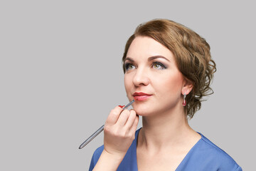 Woman do makeup. Face cosmetic brush. Skin care. Facial hightlighter. Mascara foundation. Skincare...