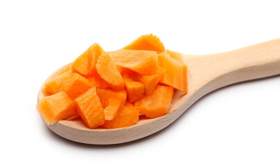 Chopped carrot slices with wooden spoon isolated on white background