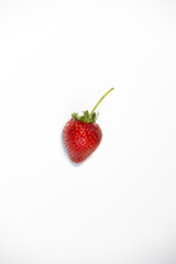A ripe and fresh Strawberry on white background, isolated, food photography concept