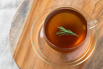Close up of rosemary tea, popular herbal drink. Healthy warm beverage for health. Top view