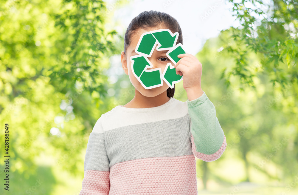 Wall mural eco living, environment and sustainability concept - smiling girl holding green recycling sign over 