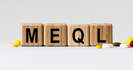 cubes with the word MEQL on them. Care concept.