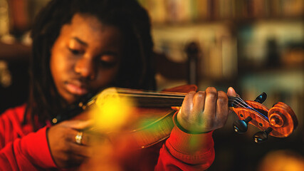 girl practicing and learning violin play at home  © august.columbo
