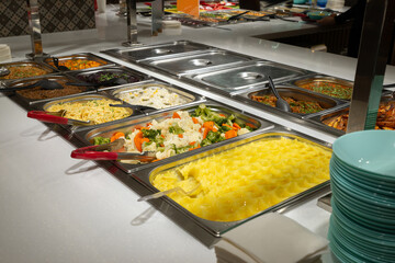 Side dishes on the serving line, self-service restaurant. steamed vegetables, rice, buckwheat, potatoes. Copispace.