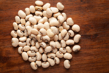 macro Close-up of Organic soybean,  (Glycine max ) or soya bean dal cleaned on wooden top background.
