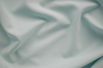 Gray fabric cotton background. display  abstract texture luxury cloth soft wave.  for well use text present or promote your goods, products on free space background. top view or flat lay.